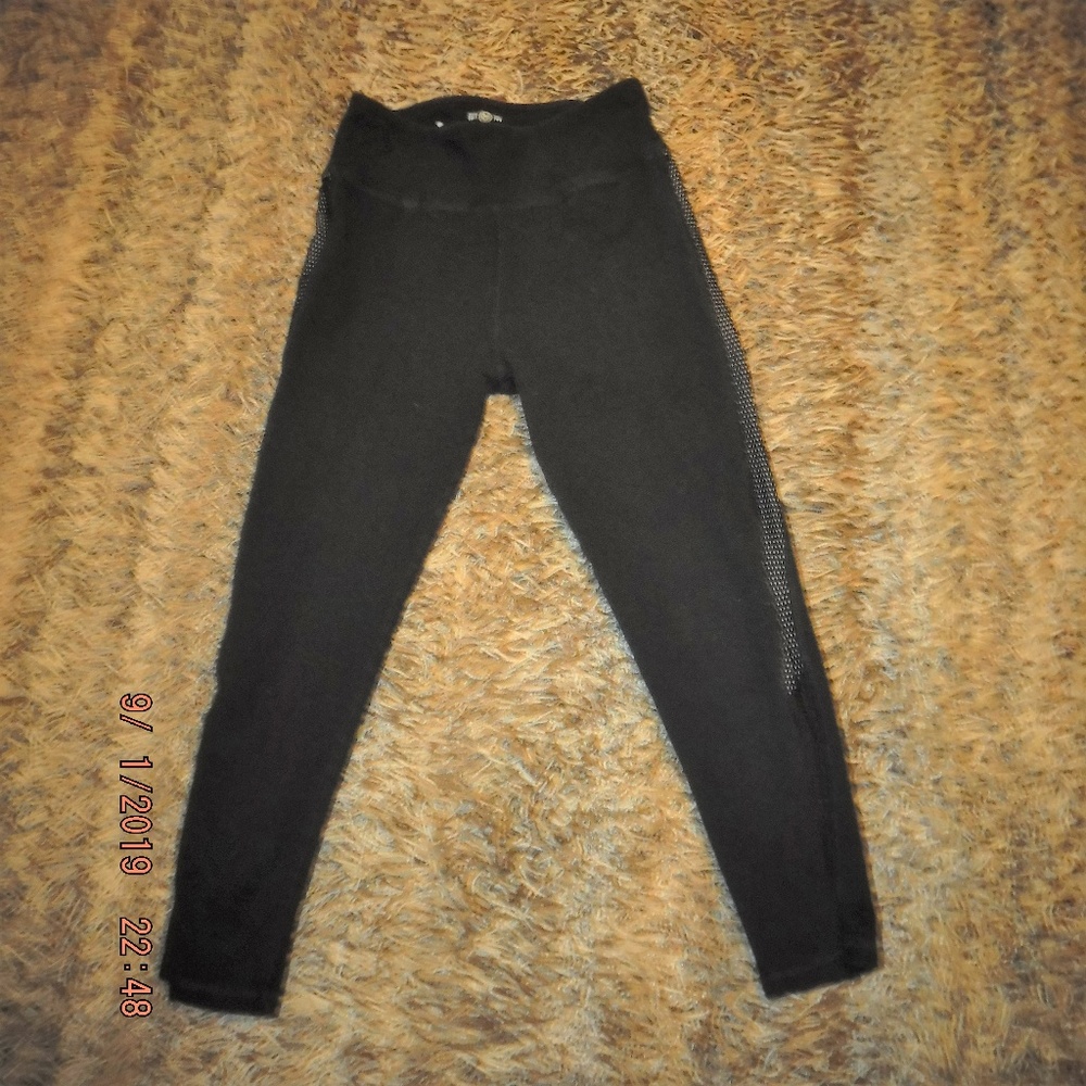 Black capris with side trim.